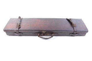 A leather gun case with fitted interior for up to 30½ ins barrels, Williams & Powell trade label (