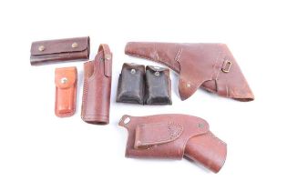 Three various leather pistol holsters, Whitby Knives sheath and other leather pouches