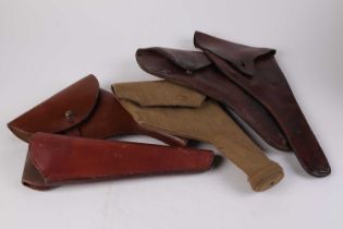 Five various holsters inc. 1940 canvas holster