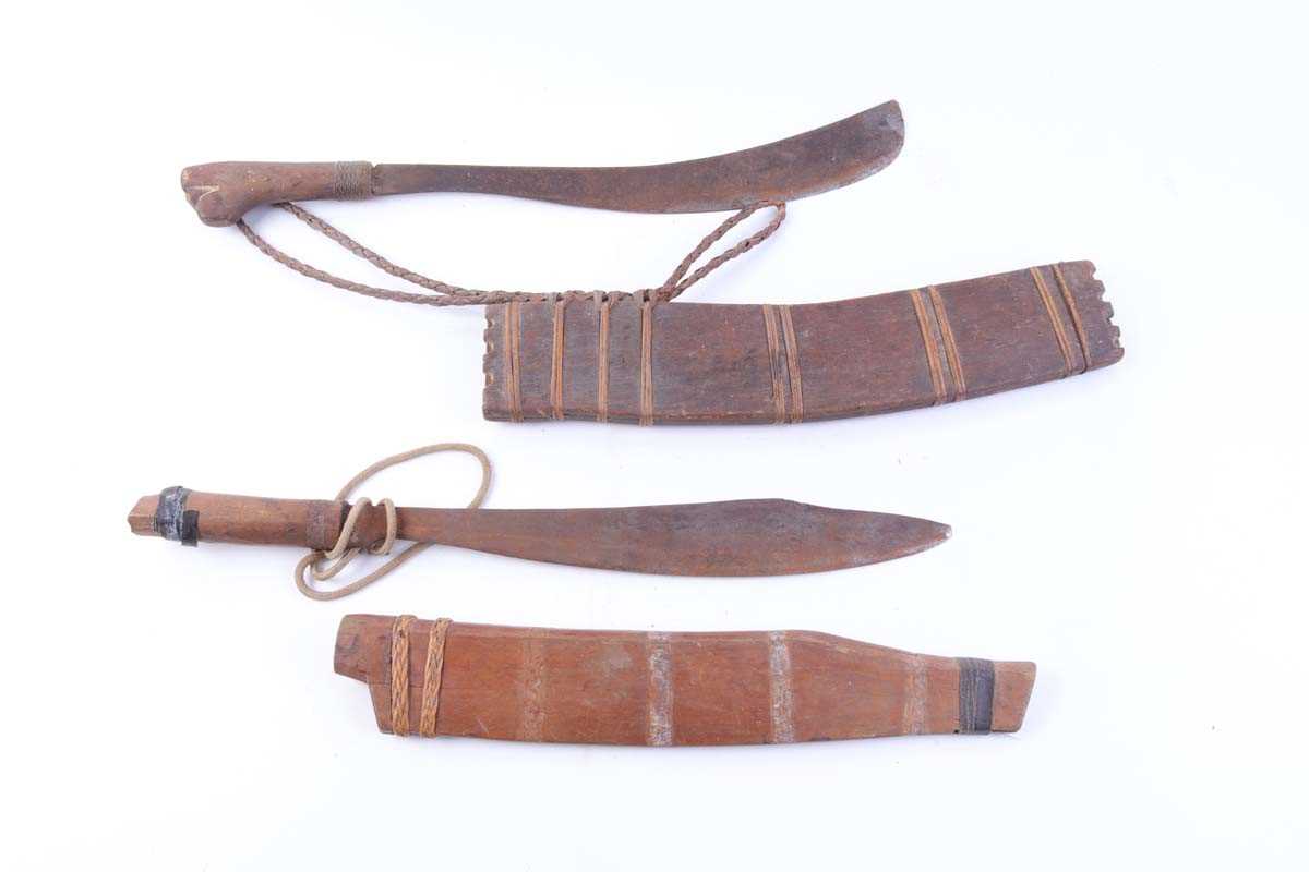 Two Eastern machetes, each in wooden scabbard