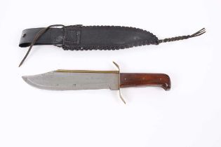 Bowie knife, 10 ins brass-backed blade stamped Pakistan, brass guard, wood grips, in a leather