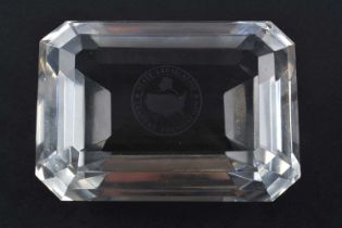 A Tiffany & Co crystal glass paperweight in the form of an emerald cut gemstone,