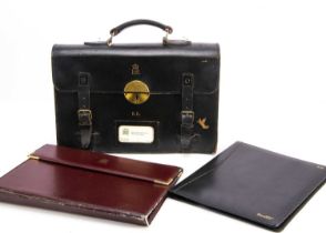 A black leather satchel briefcase,