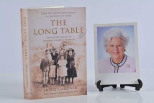 A paperback signed first edition The Long Table,