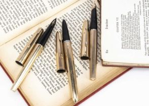 Three vintage gold plated Parker fountain pens,