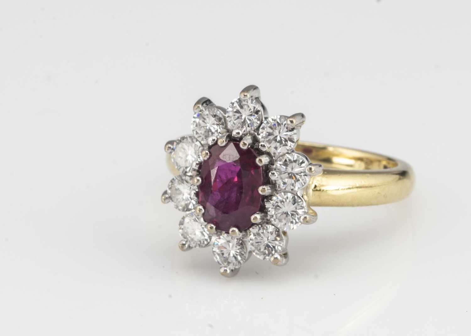 An 18ct gold ruby and diamond cluster ring, - Image 2 of 2