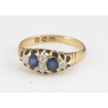 A late Victorian 18ct gold sapphire and diamond ring,