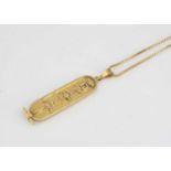 An Egyptian gold pendant on chain,