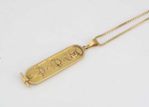 An Egyptian gold pendant on chain,