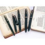 Five vintage Parker fountain pens,