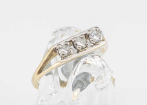 An 18ct gold three stone diamond dress ring,