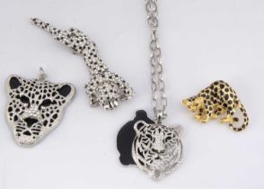 Four items of big cat costume jewellery,