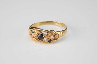 An 18ct gold sapphire and diamond crossover engagement ring,