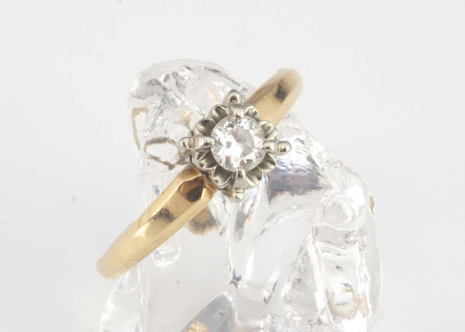 An 18ct gold Columbia marked diamond solitaire,