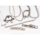A collection of silver and white metal jewels,
