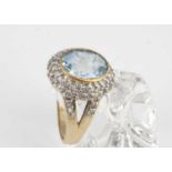 A topaz and diamond 9ct gold cluster dress ring,