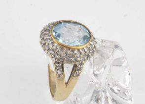 A topaz and diamond 9ct gold cluster dress ring,