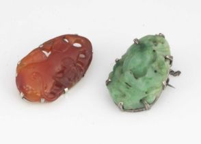 A late 19th or early 20th Century carved Chinese jade silver mounted brooch,
