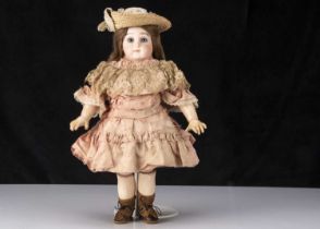 An early Portrait Jumeau pressed bisque bebe size 7,