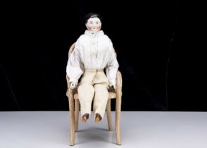 A rare mid 19th century Kister china shoulder-head boy doll with jointed wooden body,