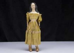 A rare mid 19th century German papier-mache shoulder-head doll with elaborate hair,