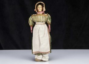 A rare mid 19th century German papier-mache shoulder-head doll with elaborate hair and moulded comb,