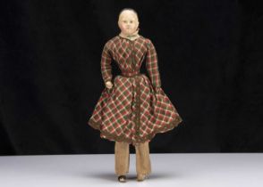 A first half of the 19th century German papier-mache shoulder-head boy doll on French kid body,