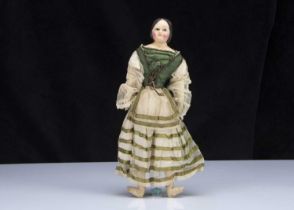 A 19th century German papier-mache doll with dipped wax finish,