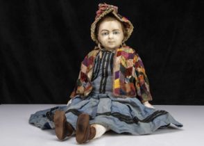 An unusually large 19th century English poured wax shoulder-head child doll,