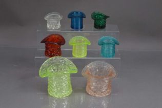 Eight 20th Century pressed glass top hat shape glass trinket pots posy vases etc,