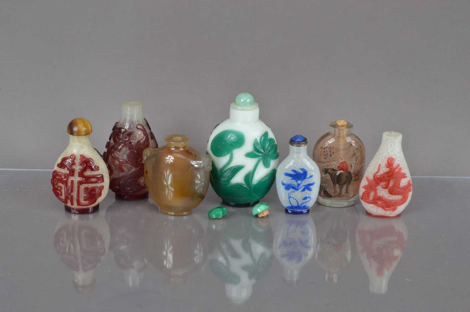 Seven mid 20th century Chinese glass scent bottles,