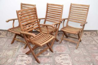 Four modern teak garden chairs,