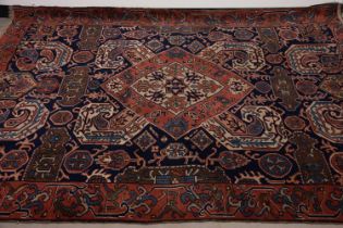 A vintage Caucasian woollen carpet,