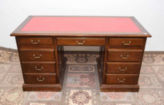 A mid to late 20th century oak twin pedestal desk,