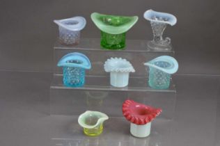 Eight 20th Century top hat shape opalescent glass trinket pots posy vases friggers etc,