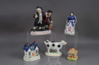 A group of five Staffordshire pottery figures, pastille burners etc,