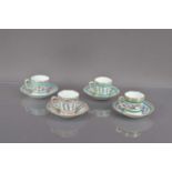 A set of four French 18th Century style porcelain cups and saucers,