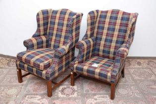 A pair of c1980s upholstered wing back armchairs,