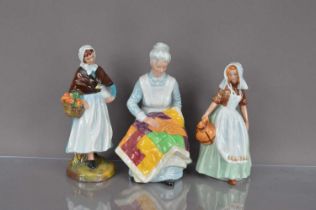 Three collectable Royal Doulton pottery figures,