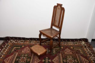 A late 19th century continental walnut and rattan chair and footstool