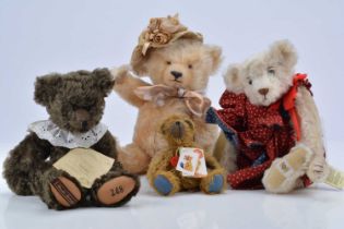 Four collectors teddy bears.