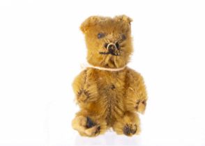 A miniature Schuco teddy bear 1920s,