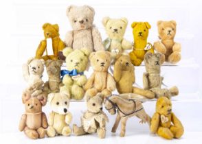 Thirteen small German pin jointed teddy bears,