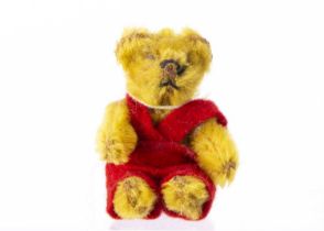 A post war miniature Schuco teddy bear,