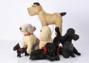 Seven soft toy dogs 1920's and later,