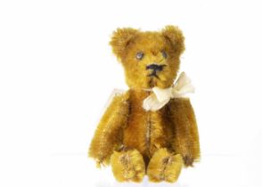 A post war miniature Schuco teddy bear,