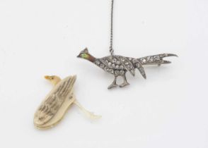 A silver enamel and paste set white metal pheasant brooch,