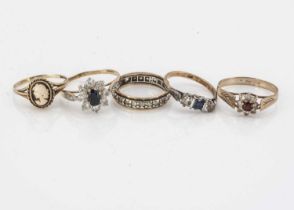A collection of five 9ct gold gold gem set rings,