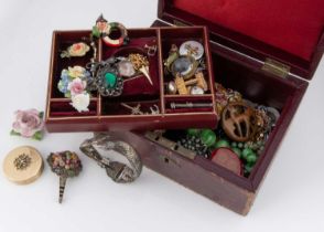 A collection of poreclain and other floral brooches,