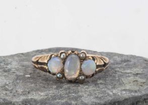 An Edwadian three stone opal and seed pearl dress ring,